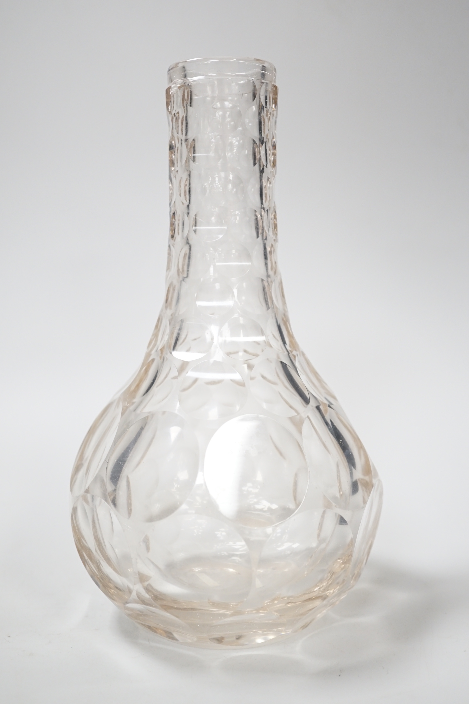 An English lead crystal shaft and globe carafe, decorated throughout with cut roundels or printies, grey dark coloured metal. early 19th century, 23cm high